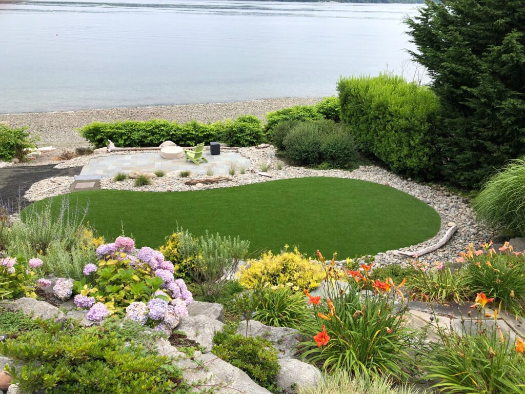 Fire pit and synthetic turf dog area for functional outdoor living space in Port Orchard, WA