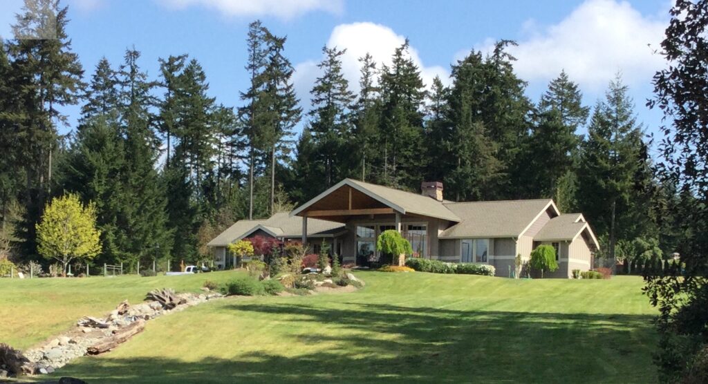 Landscape design dry creek bed to pond in Gig Harbor, WA