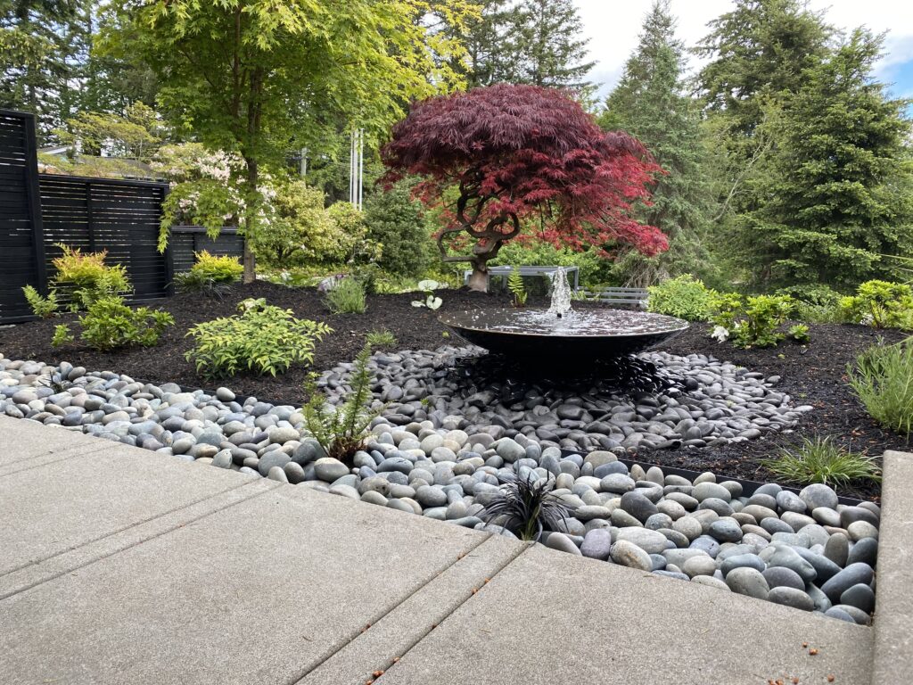 Harbor Landscape Design in Gig Harbor, WA crafts stunning outdoor spaces in the Pacific Northwest. Explore our signature custom stairs embraced by native plants, blending natural beauty and meticulous design expertise.
